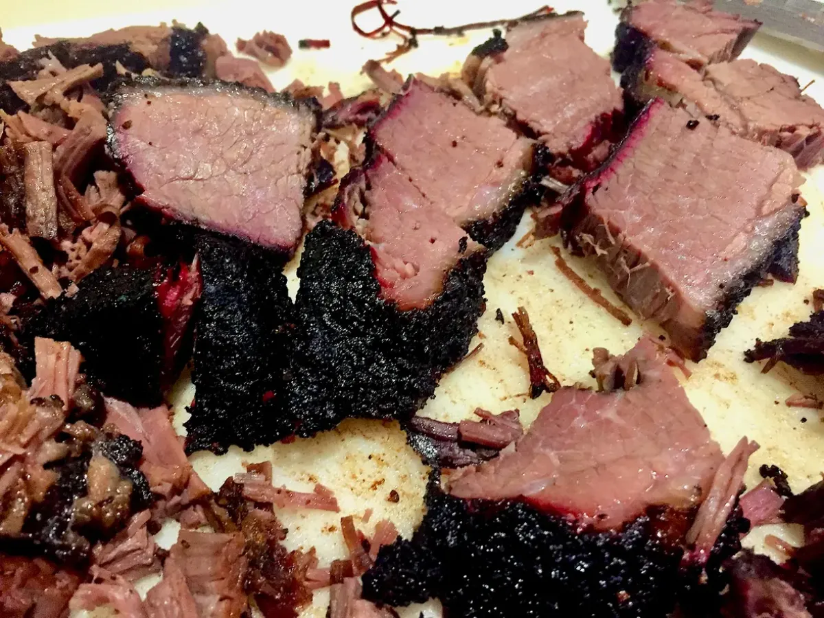 Sliced cubes of freshly smoked beef brisket.