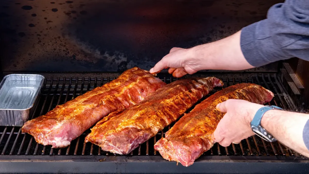 Smoker filled with delicious ribs.